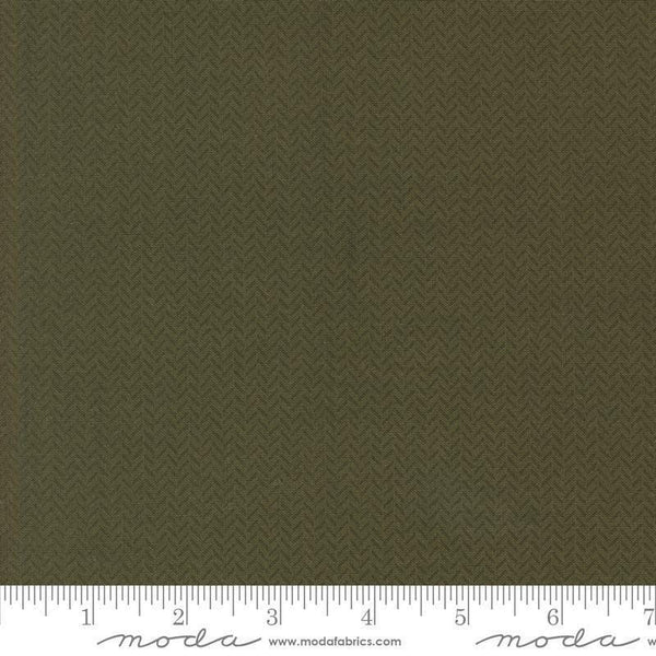 Image of the Berry and Pine Yule Wintergreen quilting cotton fabric by Moda Fabrics. Features lines on a green background. Cute Little Fabric Shop