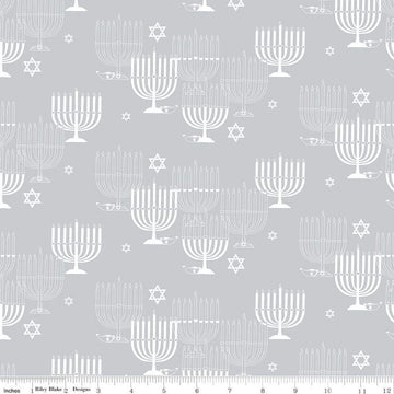 Image of the 8 Nights, 8 Lights Main Silver quilting cotton fabric by Riley Blake Designs. Features stars on a white background. Cute Little Fabric Shop