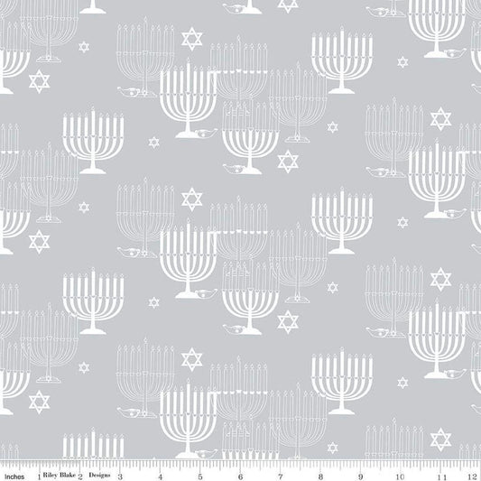 Image of the 8 Nights, 8 Lights Main Silver quilting cotton fabric by Riley Blake Designs. Features stars on a white background. Cute Little Fabric Shop