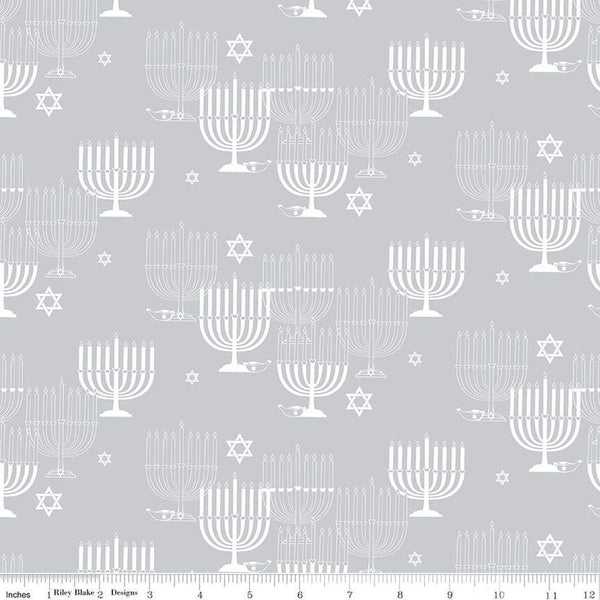 Image of the 8 Nights, 8 Lights Main Silver quilting cotton fabric by Riley Blake Designs. Features stars on a white background. Cute Little Fabric Shop