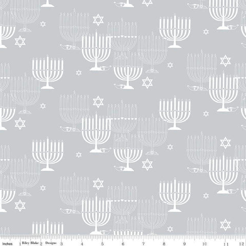 Image of the 8 Nights, 8 Lights Main Silver quilting cotton fabric by Riley Blake Designs. Features stars on a white background. Cute Little Fabric Shop