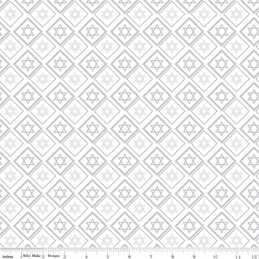 Image of the 8 Nights, 8 Lights Star of David White quilting cotton fabric by Riley Blake Designs. Features stars on a white background. Cute Little Fabric Shop