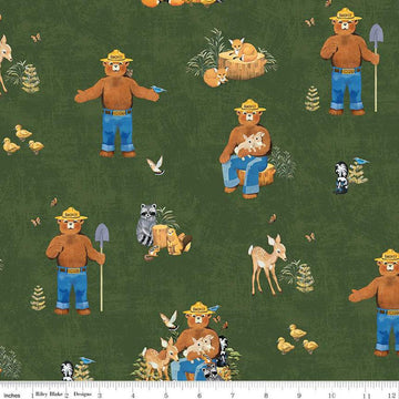 Image of the Friends of Smokey Bear Main Forest quilting cotton fabric. Features animals on a green background. Cute Little Fabric Shop