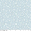 Image of the Santa's Tree Farm Snowflake Sky quilting cotton fabric by Riley Blake Designs. Features snowflakes on a blue background. Cute Little Fabric Shop