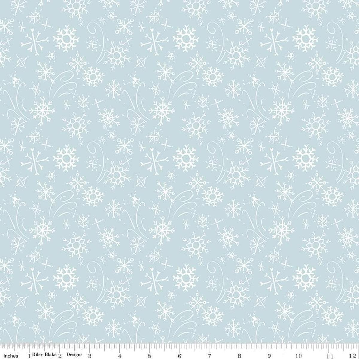 Image of the Santa's Tree Farm Snowflake Sky quilting cotton fabric by Riley Blake Designs. Features snowflakes on a blue background. Cute Little Fabric Shop