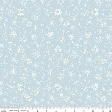 Image of the Santa's Tree Farm Snowflake Sky quilting cotton fabric by Riley Blake Designs. Features snowflakes on a blue background. Cute Little Fabric Shop