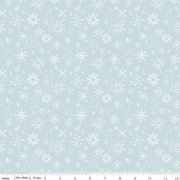 Image of the Santa&#39;s Tree Farm Snowflake Sky quilting cotton fabric by Riley Blake Designs. Features snowflakes on a blue background. Cute Little Fabric Shop