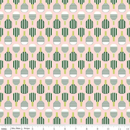 Image of the Pickleball Paddles Blush quilting cotton fabric by Riley Blake Designs. Features paddles on a pink background. Cute Little Fabric Shop