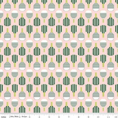 Image of the Pickleball Paddles Blush quilting cotton fabric by Riley Blake Designs. Features paddles on a pink background. Cute Little Fabric Shop