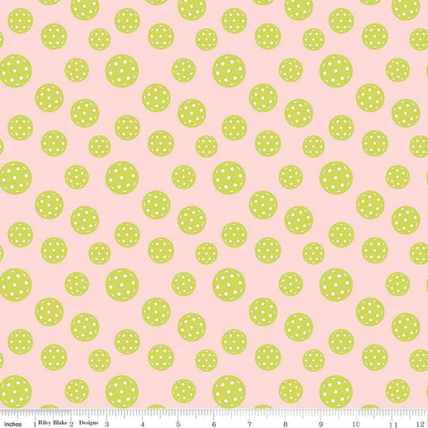 Image of the Pickleball Pickleballs Blush quilting cotton fabric by Riley Blake Designs. Features pickleballs on a pink background. Cute Little Fabric Shop