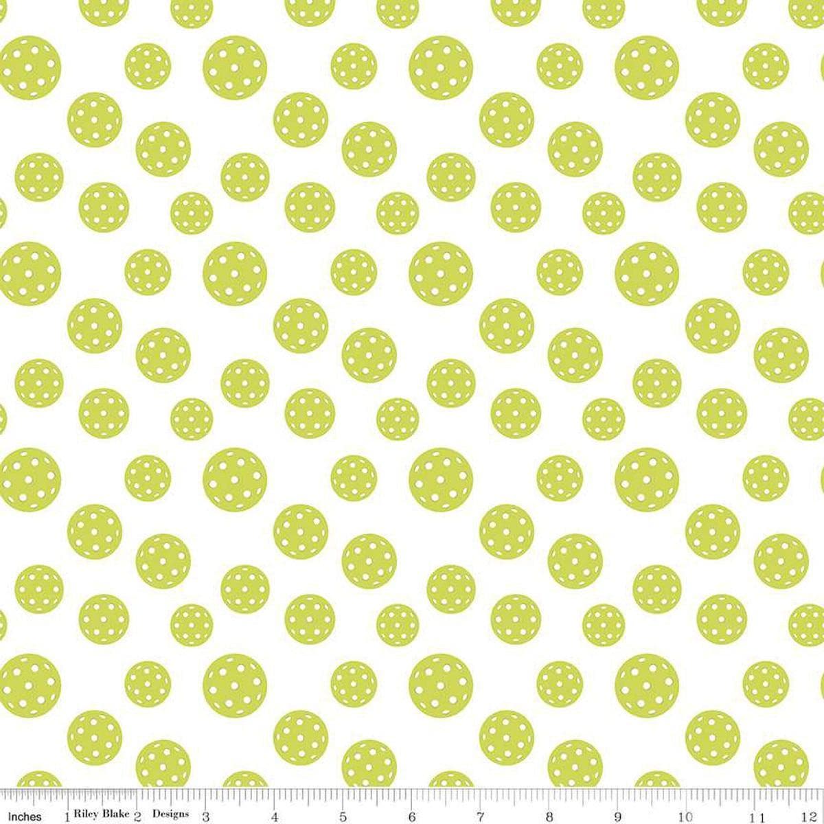 Image of the Pickleball Pickleballs White quilting cotton fabric by Riley Blake Designs. Features pickleballs on a white background. Cute Little Fabric Shop
