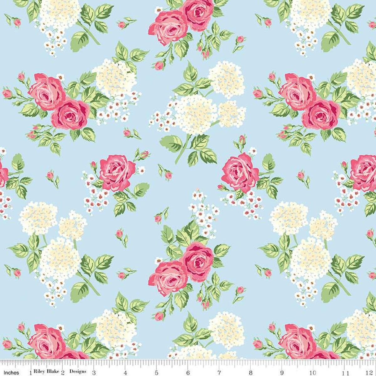 Image of the Bluegrass Charm Main Mist quilting cotton fabric by Riley Blake Designs. Features flowers on a blue background. Cute Little Fabric Shop