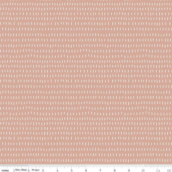 Image of the Cozy Bebe Dashes Mellow Rose quilting cotton by Riley Blake Designs. Features lines on a pink background. Cute Little Fabric Shop