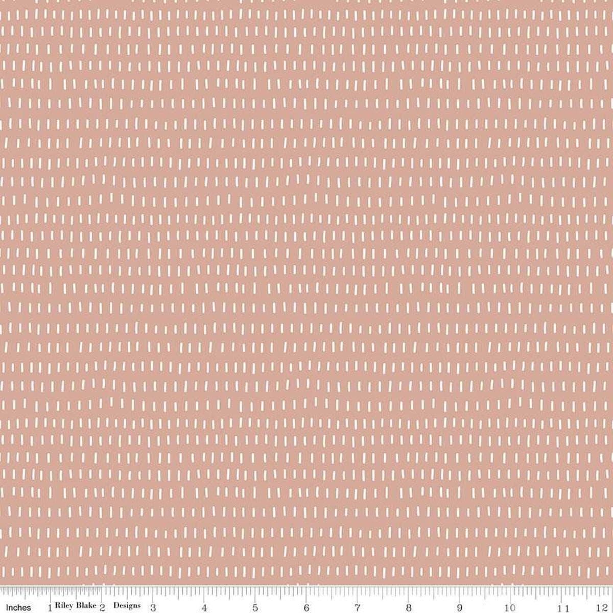 Image of the Cozy Bebe Dashes Mellow Rose quilting cotton by Riley Blake Designs. Features lines on a pink background. Cute Little Fabric Shop