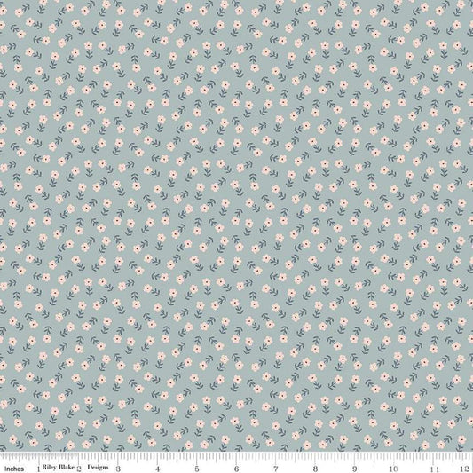 Image of the Cozy Bebe Flowers Dove quilting cotton by Riley Blake Designs. Features flowers on a blue background. Cute Little Fabric Shop