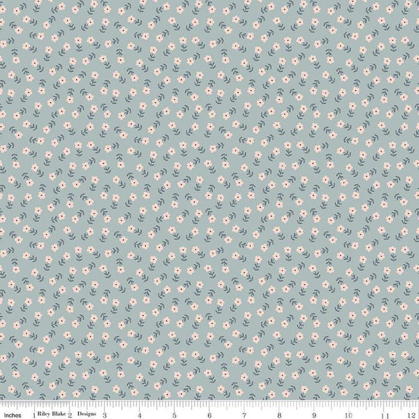 Image of the Cozy Bebe Flowers Dove quilting cotton by Riley Blake Designs. Features flowers on a blue background. Cute Little Fabric Shop