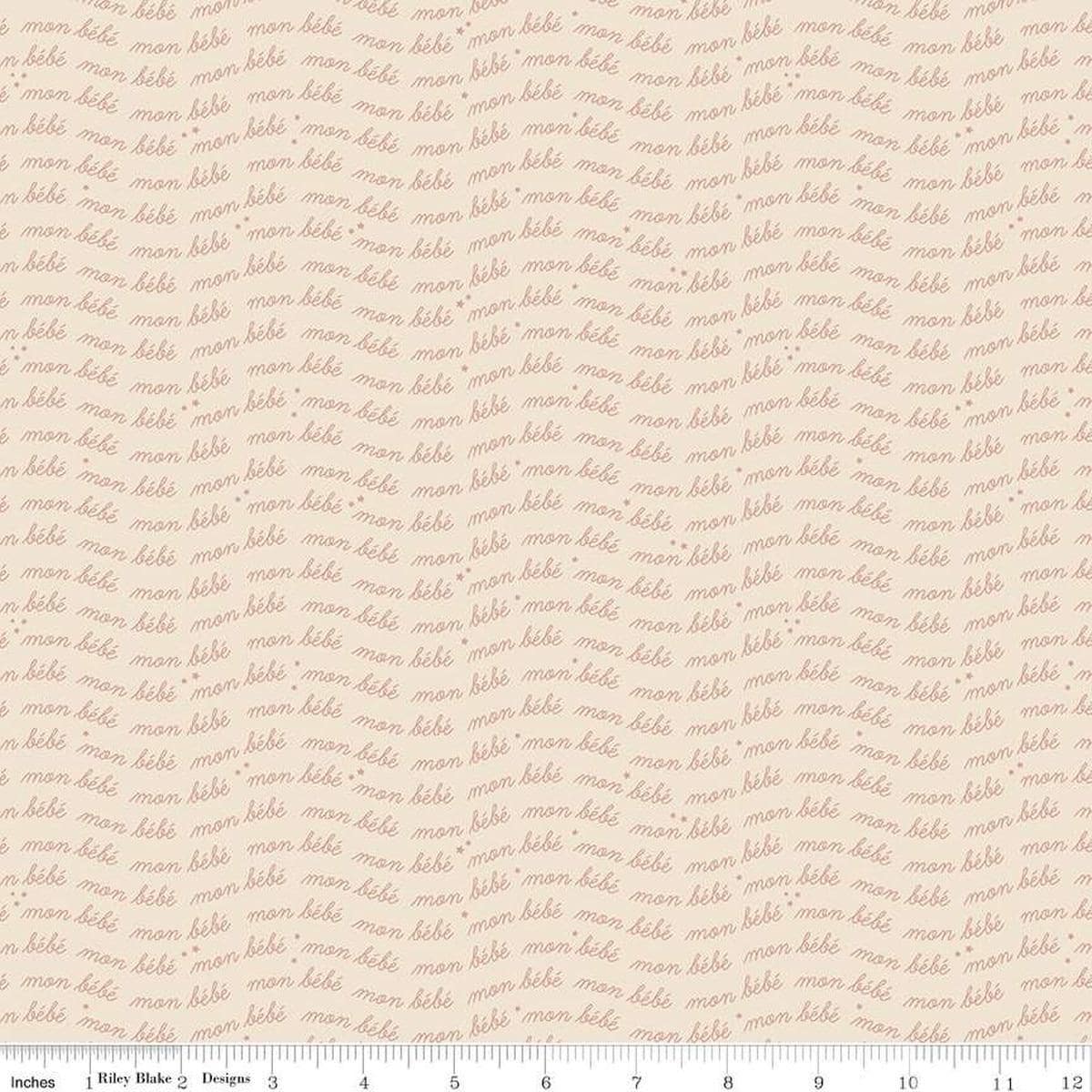 Image of the Cozy Bebe Text Cream quilting cotton by Riley Blake Designs. Features text on a cream background. Cute Little Fabric Shop