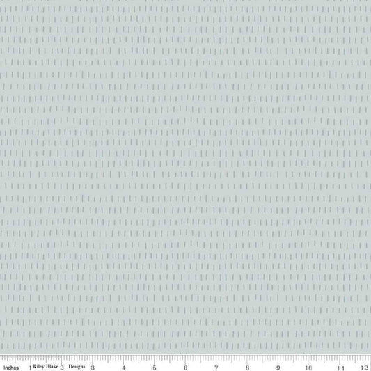 Image of the Cozy Bebe Dashes Light Blue quilting cotton by Riley Blake Designs. Features lines on a blue background. Cute Little Fabric Shop