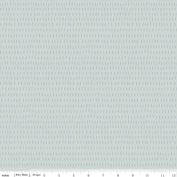 Image of the Cozy Bebe Dashes Light Blue quilting cotton by Riley Blake Designs. Features lines on a blue background. Cute Little Fabric Shop