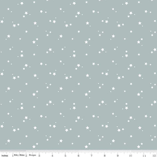 Image of the Cozy Bebe Stars Dove quilting cotton by Riley Blake Designs. Features stars on a blue background. Cute Little Fabric Shop