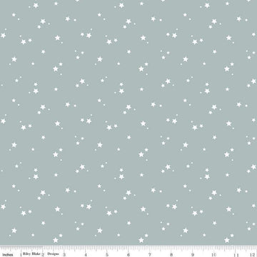 Image of the Cozy Bebe Stars Dove quilting cotton by Riley Blake Designs. Features stars on a blue background. Cute Little Fabric Shop