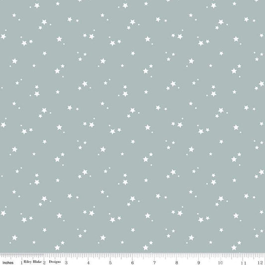 Image of the Cozy Bebe Stars Dove quilting cotton by Riley Blake Designs. Features stars on a blue background. Cute Little Fabric Shop