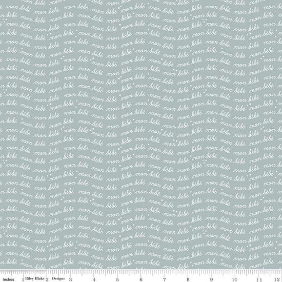 Image of the Cozy Bebe Text Dove quilting cotton by Riley Blake Designs. Features text on a blue background. Cute Little Fabric Shop