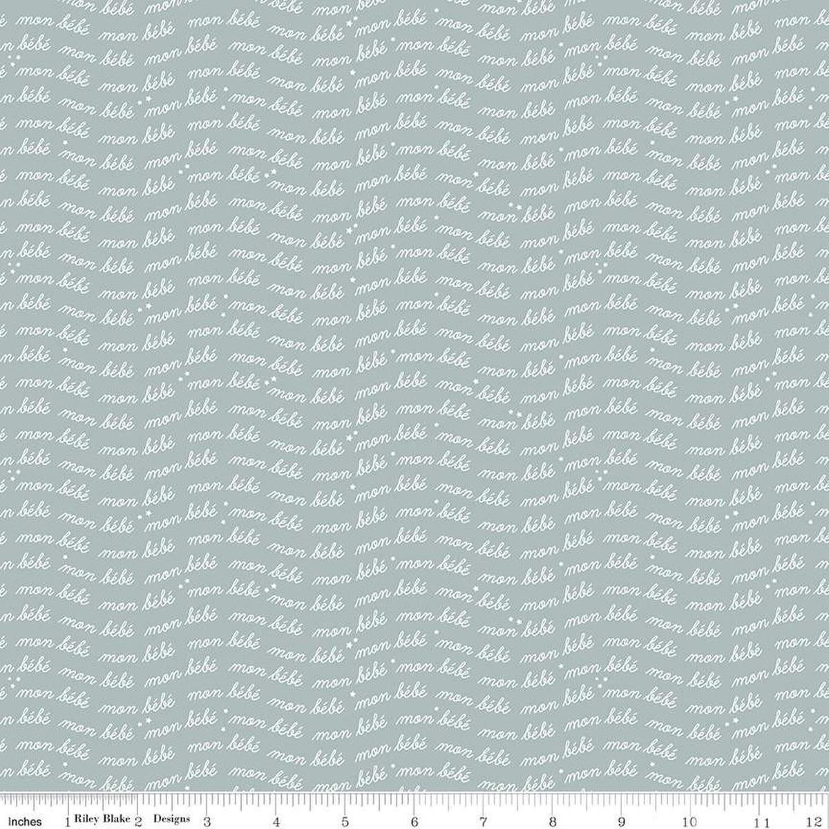 Image of the Cozy Bebe Text Dove quilting cotton by Riley Blake Designs. Features text on a blue background. Cute Little Fabric Shop