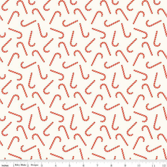 Image of the Flannel Candy Canes Cream quilting cotton fabric by Riley Blake Designs. Features candy canes on a cream background. Cute Little Fabric Shop