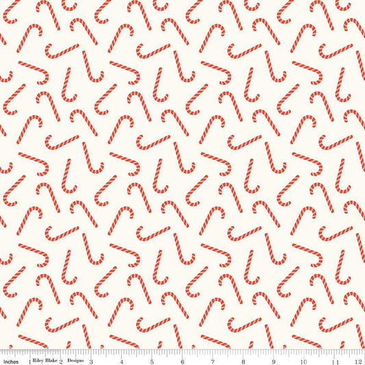 Image of the Flannel Candy Canes Cream quilting cotton fabric by Riley Blake Designs. Features candy canes on a cream background. Cute Little Fabric Shop