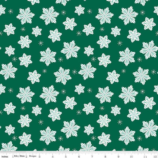 Image of the Flannel Snowflakes Green quilting cotton fabric by Riley Blake Designs. Features snowflakes on a green background. Cute Little Fabric Shop