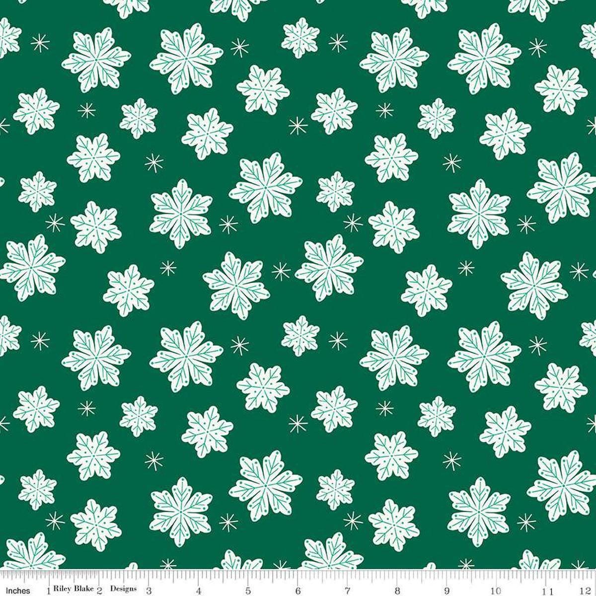 Image of the Flannel Snowflakes Green quilting cotton fabric by Riley Blake Designs. Features snowflakes on a green background. Cute Little Fabric Shop