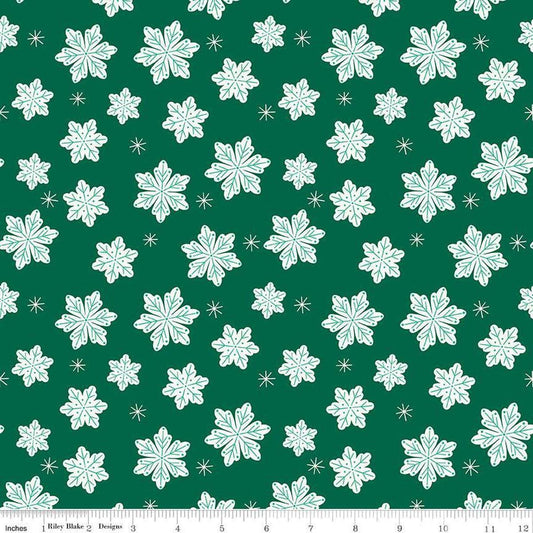 Image of the Flannel Snowflakes Green quilting cotton fabric by Riley Blake Designs. Features snowflakes on a green background. Cute Little Fabric Shop