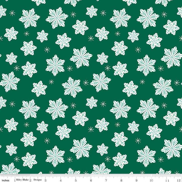 Image of the Flannel Snowflakes Green quilting cotton fabric by Riley Blake Designs. Features snowflakes on a green background. Cute Little Fabric Shop