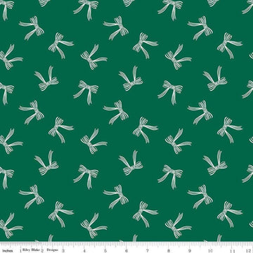 Image of the Flannel Bows Green quilting cotton fabric by Riley Blake Designs. Features bows on a green background. Cute Little Fabric Shop