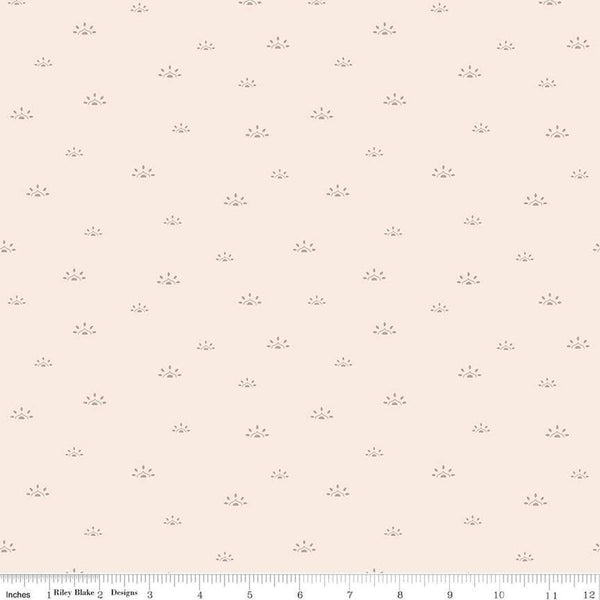 Image of the Winged Medley Woodblock Latte quilting cotton fabric. Features suns on a cream background. Cute Little Fabric Shop