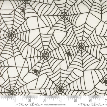 Image of the Fab Boo Lous Webs Ghostly quilting cotton fabric. Features spiderwebs on a cream background. Cute Little Fabric Shop