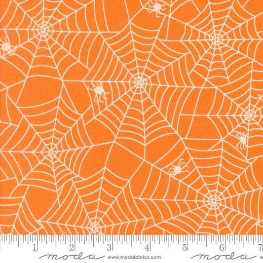 Image of the Fab Boo Lous Webs Pumpkin quilting cotton fabric. Features spiderwebs on an orange background. Cute Little Fabric Shop