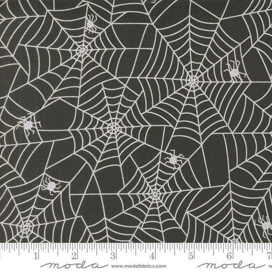 Image of the Fab Boo Lous Webs Night quilting cotton fabric. Features spiderwebs on a black background. Cute Little Fabric Shop