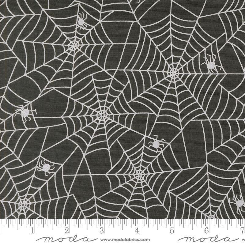 Image of the Fab Boo Lous Webs Night quilting cotton fabric. Features spiderwebs on a black background. Cute Little Fabric Shop