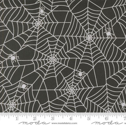 Image of the Fab Boo Lous Webs Night quilting cotton fabric. Features spiderwebs on a black background. Cute Little Fabric Shop