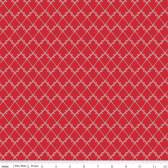 Image of the Mistletoe & Holly Candy Canes Red quilting cotton fabric by Riley Blake Designs. Features candy on a red background. Cute Little Fabric Shop