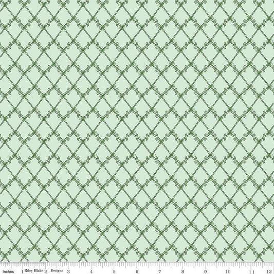 Image of the Mistletoe & Holly Candy Canes Hint of Mint quilting cotton fabric by Riley Blake Designs. Features candy on a green background. Cute Little Fabric Shop