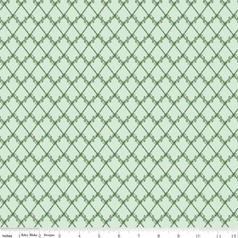 Image of the Mistletoe & Holly Candy Canes Hint of Mint quilting cotton fabric by Riley Blake Designs. Features candy on a green background. Cute Little Fabric Shop