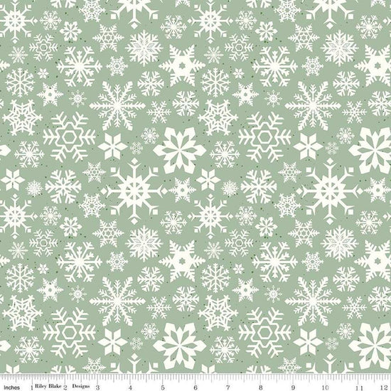 Image of the Mistletoe & Holly Snowflakes Sage quilting cotton fabric by Riley Blake Designs. Features snowflakes on a green background. Cute Little Fabric Shop