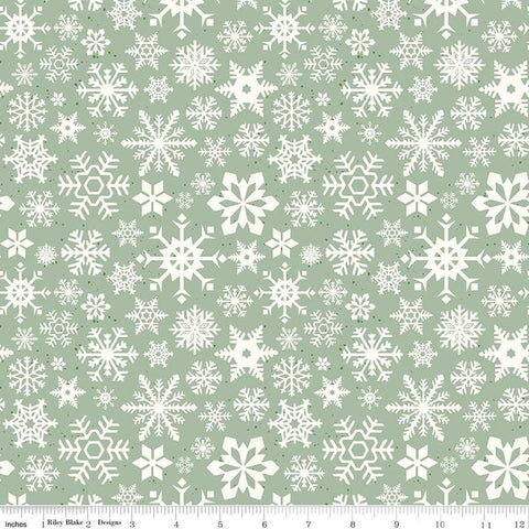 Image of the Mistletoe & Holly Snowflakes Sage quilting cotton fabric by Riley Blake Designs. Features snowflakes on a green background. Cute Little Fabric Shop