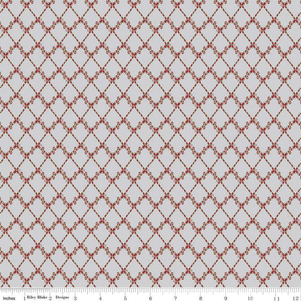 Image of the Mistletoe & Holly Candy Canes Silver quilting cotton fabric by Riley Blake Designs. Features candy on a gray background. Cute Little Fabric Shop