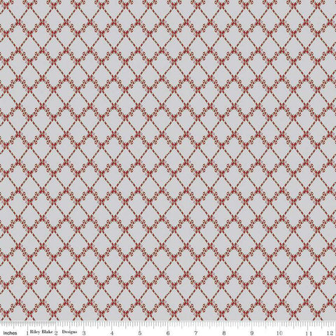 Image of the Mistletoe & Holly Candy Canes Silver quilting cotton fabric by Riley Blake Designs. Features candy on a gray background. Cute Little Fabric Shop