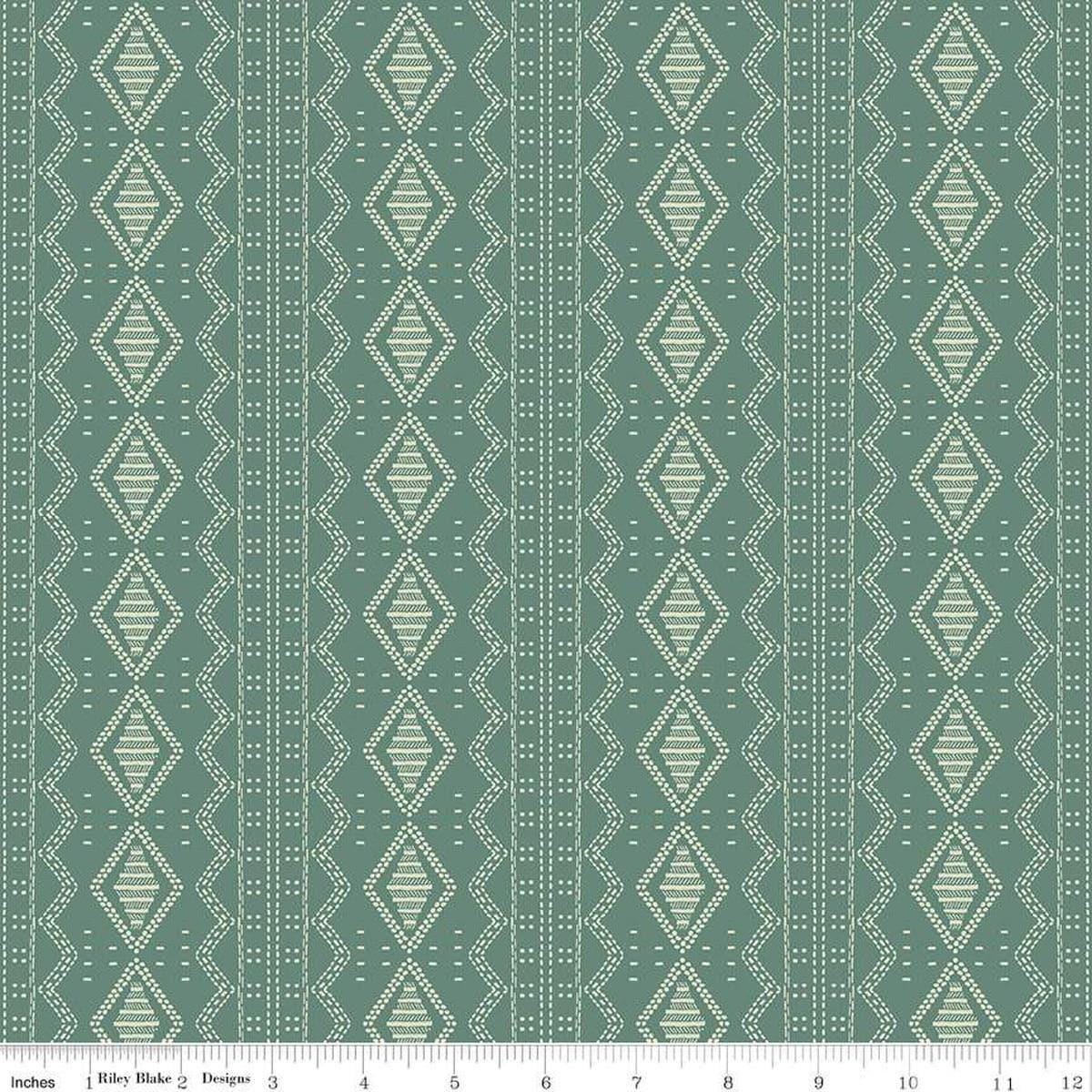 Image of the Winged Medley Textile Teal quilting cotton fabric. Features tiles on a green background. Cute Little Fabric Shop