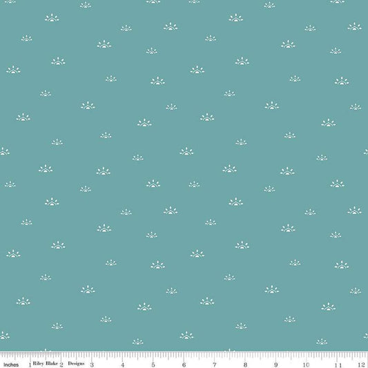 Image of the Winged Medley Woodblock Teal quilting cotton fabric. Features suns on a teal background. Cute Little Fabric Shop